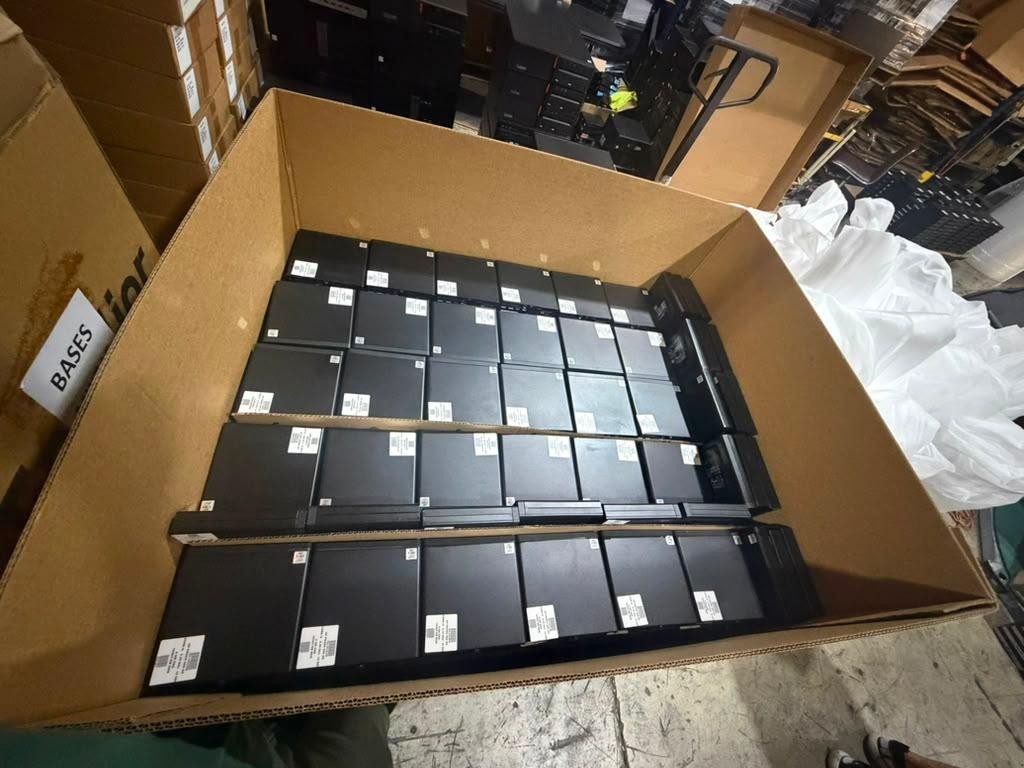 Bulk refurbished computer inventory in shipping container